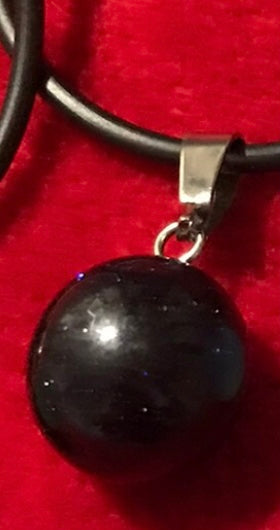 Ball-shaped gemstone crystal pendant necklace.