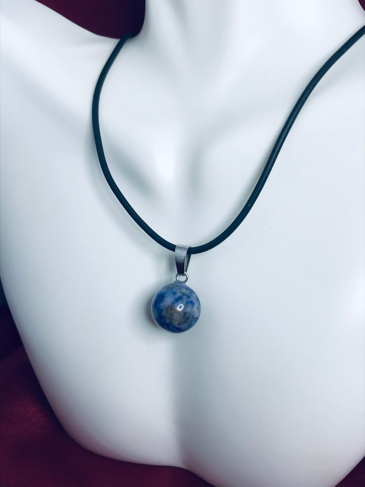 Ball-shaped gemstone crystal pendant necklace.