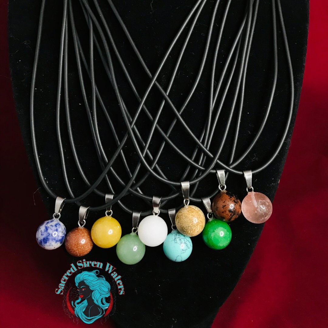 Ball-shaped gemstone crystal pendant necklace.